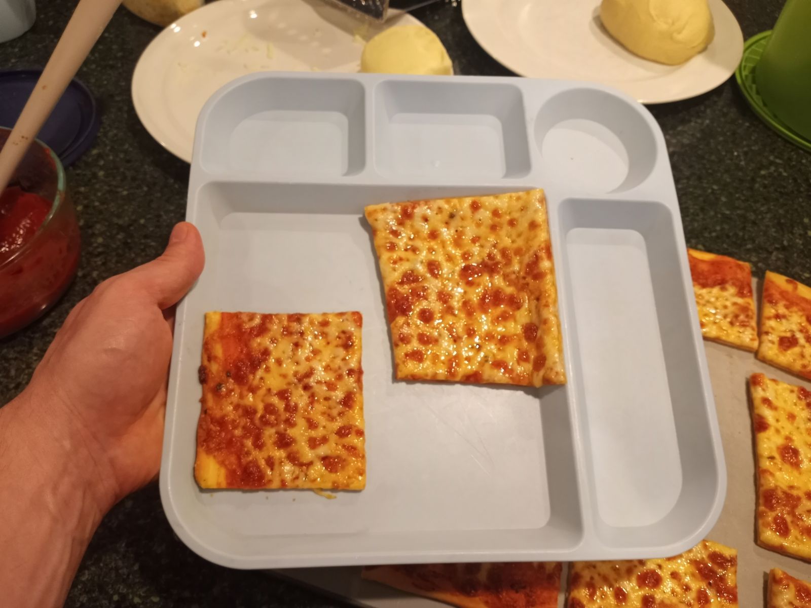 Homemade cheese pizza on lunch tray